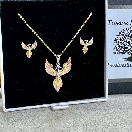 Twelve silver trees jewellery Phoenix rising gift set featuring intricate Phoenix stud earrings and matching pendant made in 925 sterling silver and finished in luxurious rhodium, yellow and rose gold vermeil. Presented in our signature matchbox style gift box.