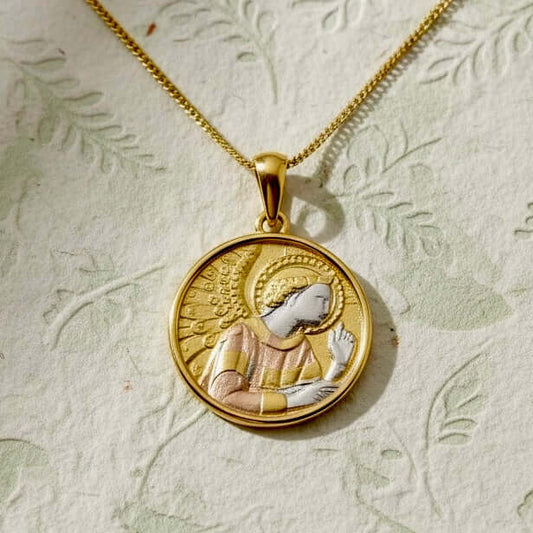Artisan sterling silver pendant of the Archangel Gabriel, a symbol of guidance and deliverance, finish in rhodium, rose and yellow gold on a flowal background from Twelve Silver Trees Jewellery and Gifts