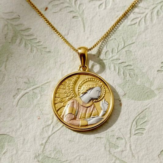 Artisan sterling silver pendant of the Archangel Gabriel, a symbol of guidance and deliverance, finish in rhodium, rose and yellow gold on a flowal background from Twelve Silver Trees Jewellery and Gifts