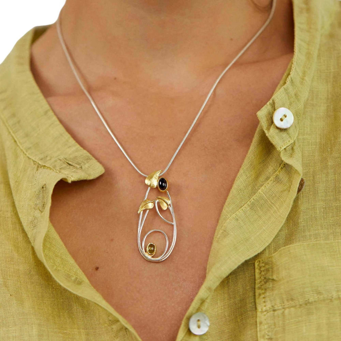 Art nouveau style Iolite and peridot handmade silver pendant inspired by Margaret Macdonald Mackintosh