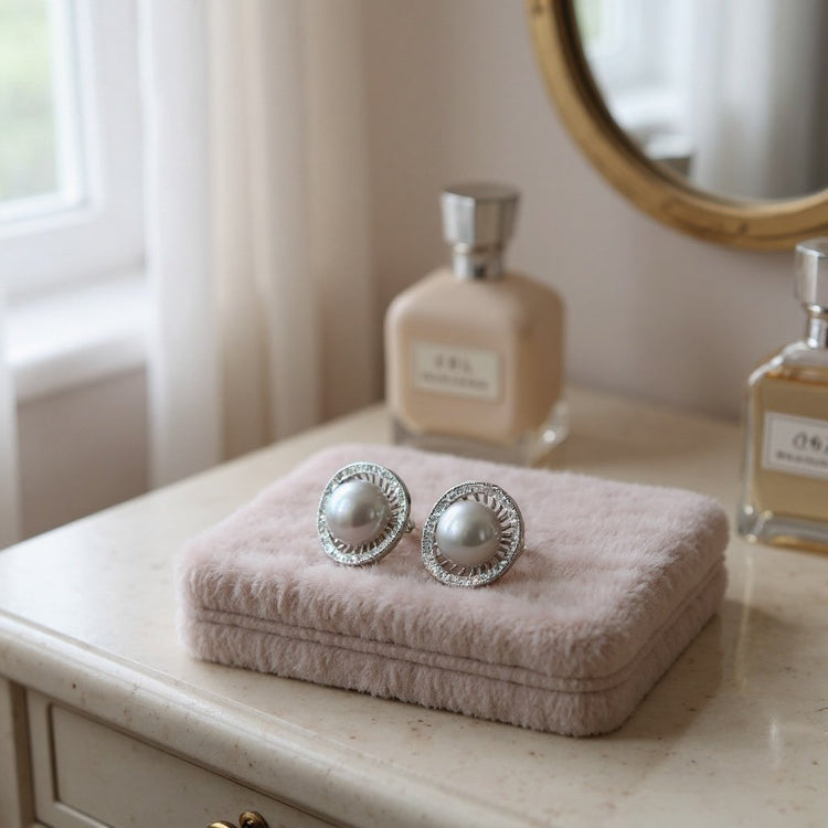 Image large grey freshwater pear stud earrings displayed on a velvet box on a dressing table 