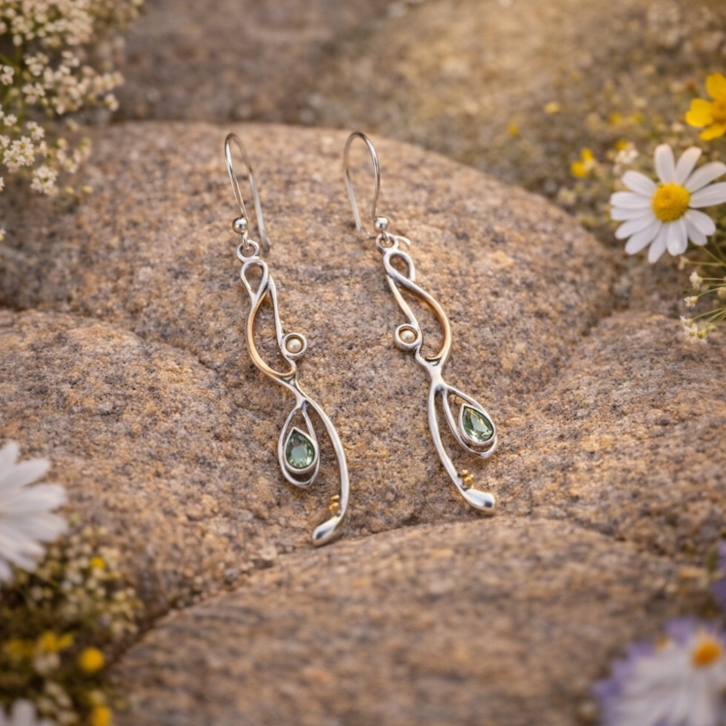 Green amethyst and pearl drop earrings on stone in warm sunlight, Sunlit Earth collection, sterling silver with gold detailing