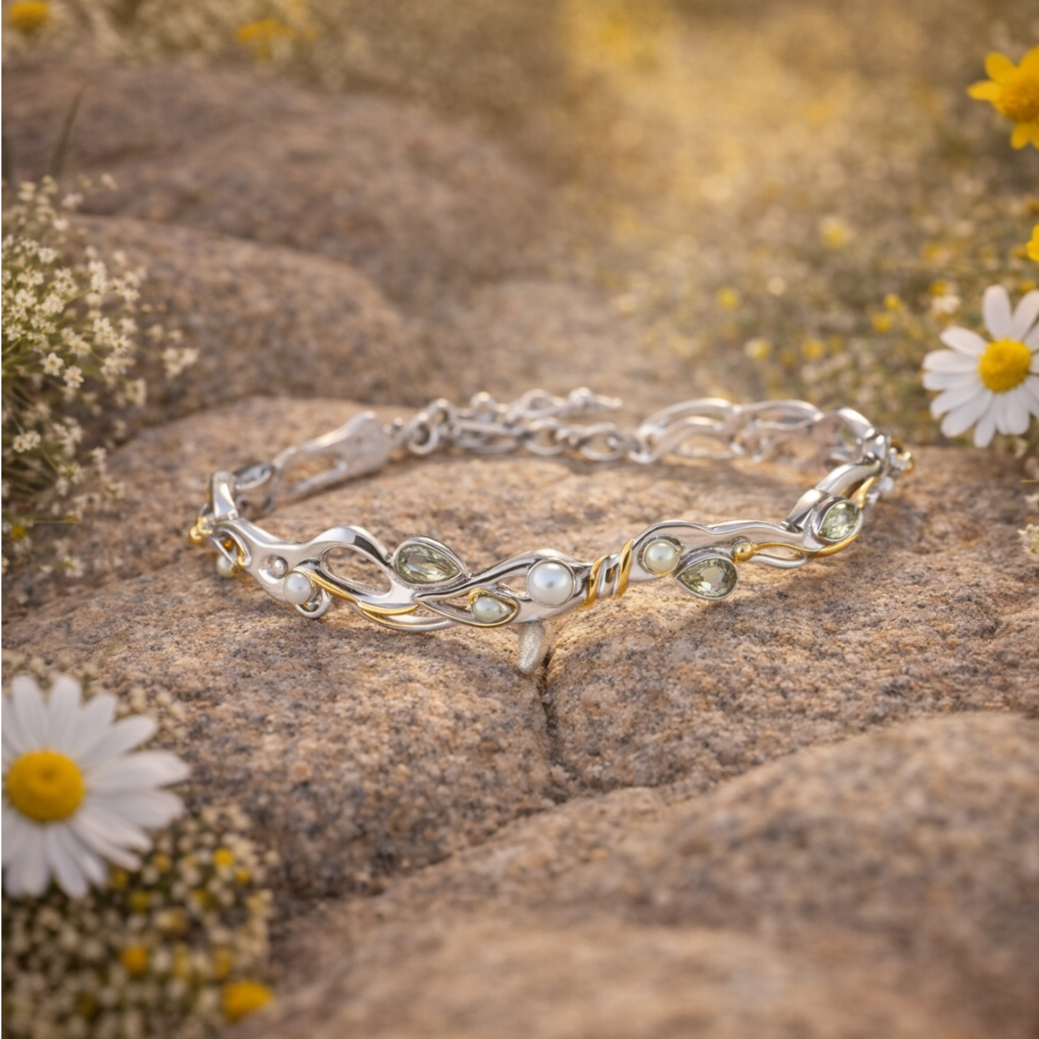 Green amethyst and pearl bracelet on soft white surface with floral detail, sterling silver with gold accents
