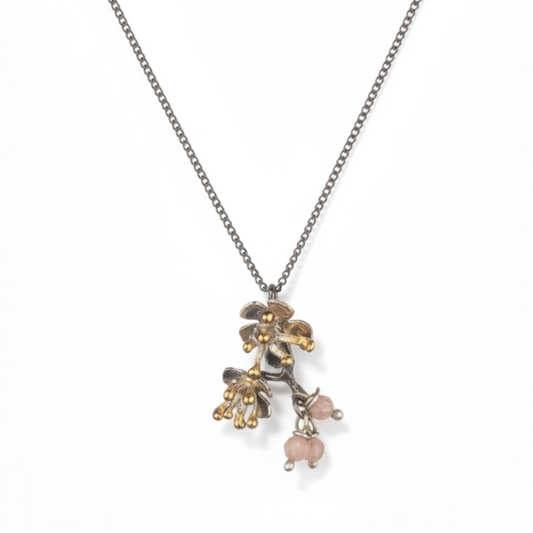 Almond Blossom branch pendant necklace in sterling silver with pink gemstone accents