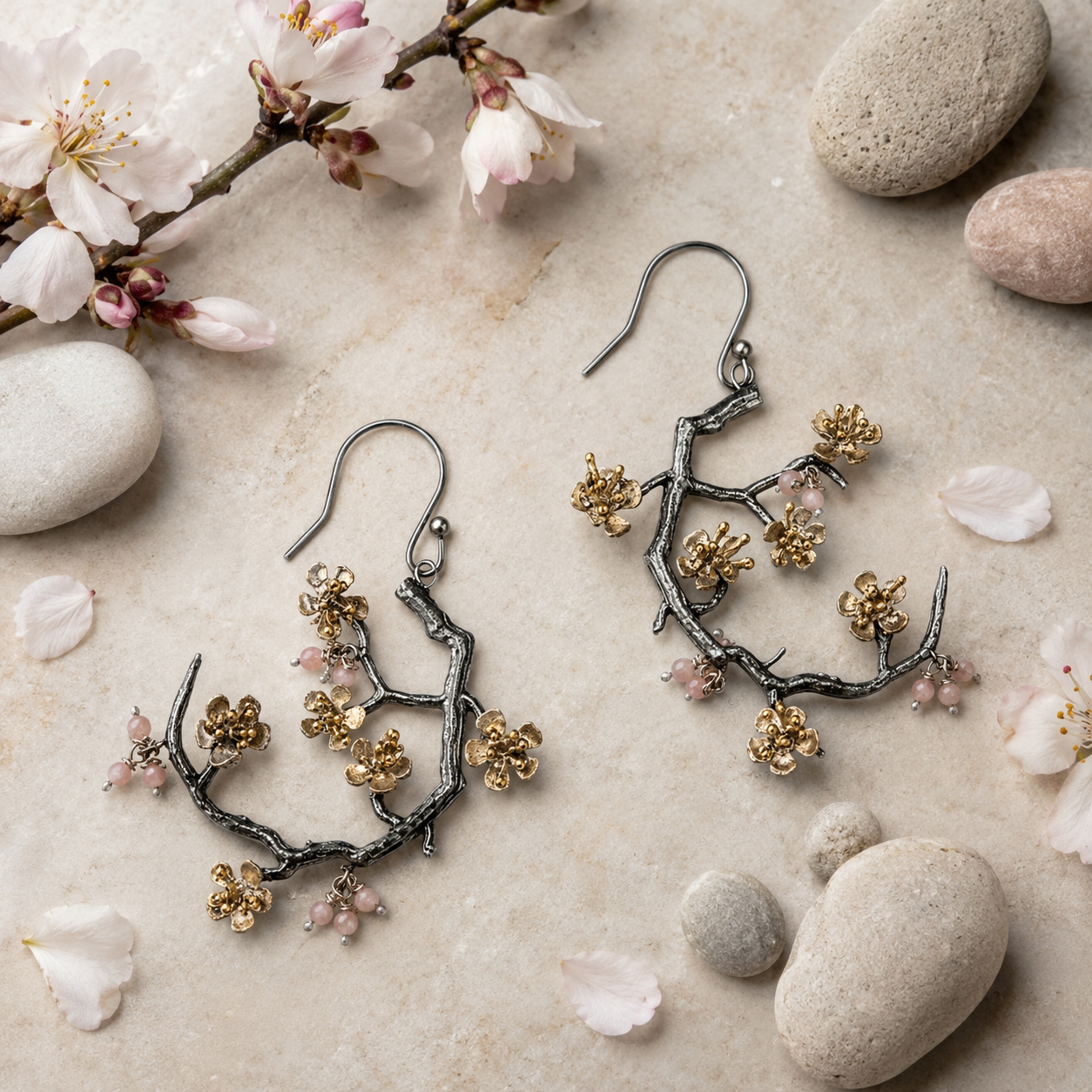 Almond Blossom statement earrings inspired by flowering branches displayed on a botanical flatlay