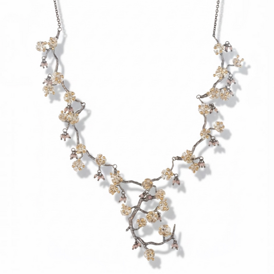 Almond Blossom statement necklace inspired by flowering branches with pink gemstone accents