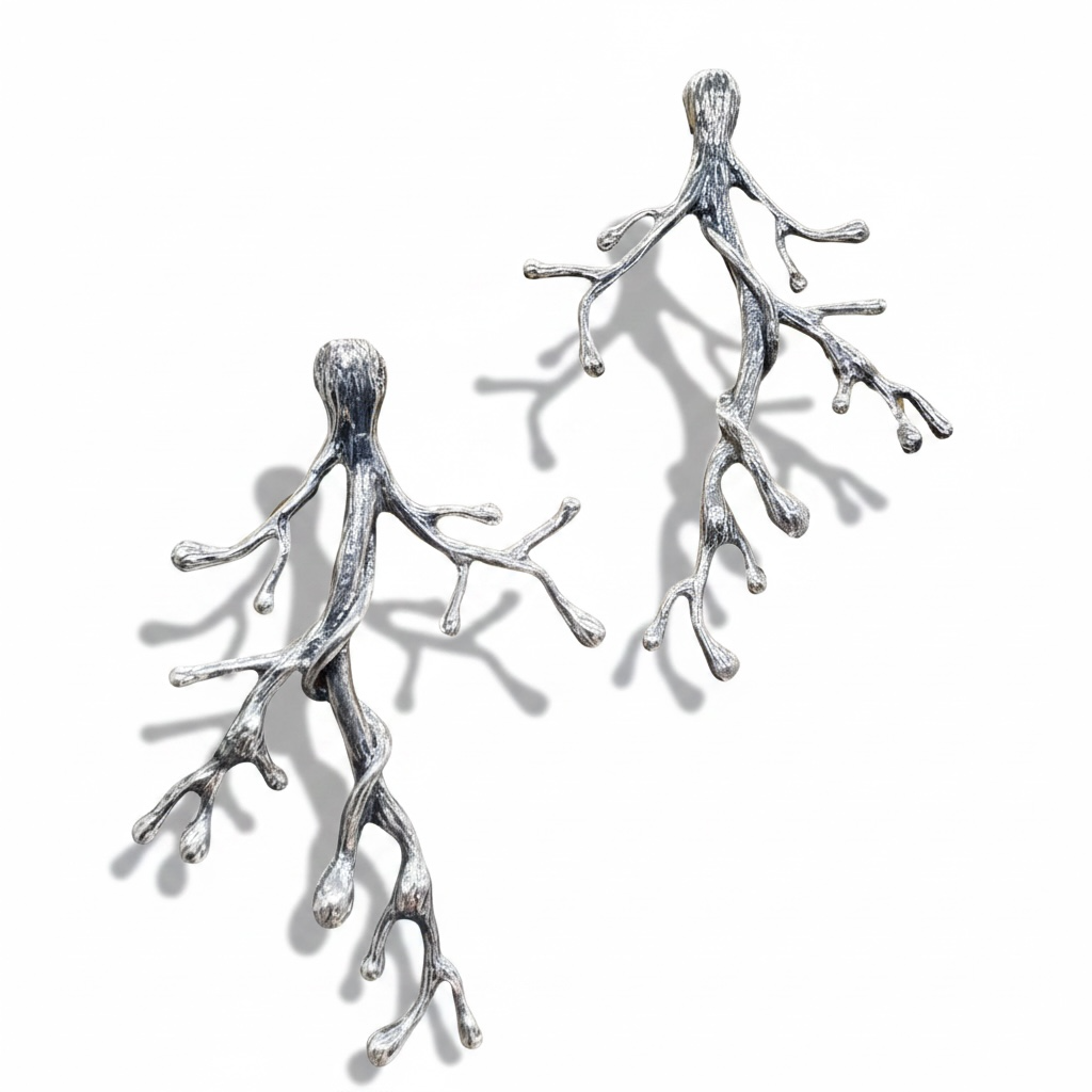 Ancient Woodland Branch Earrings handcrafted in sterling silver showing organic branch textures and sculptural shadows