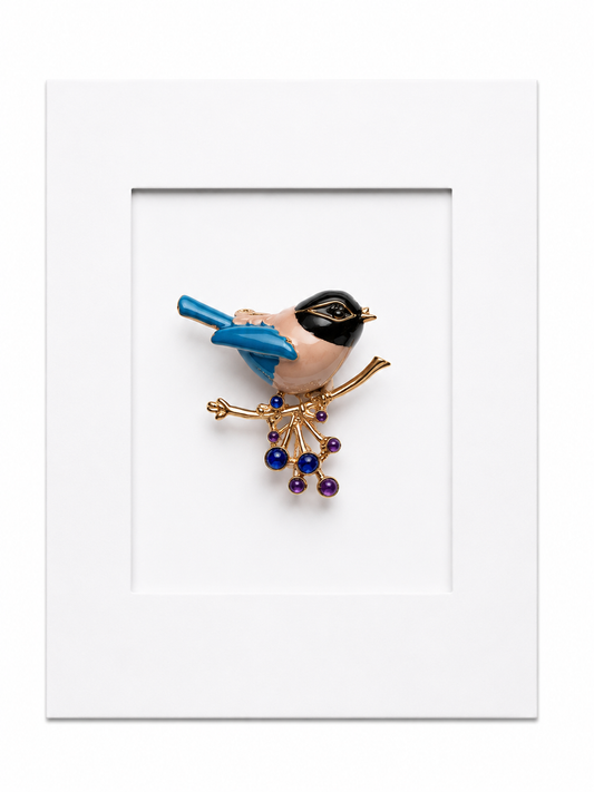 Keepsake brooch card featuring a blue songbird brooch perched on a berry branch on a white display card