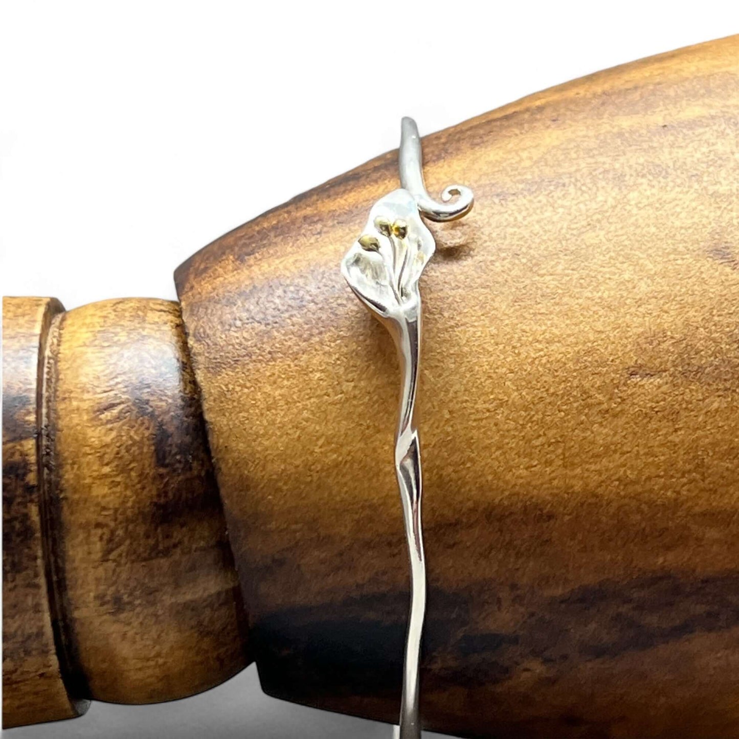 Front view of handcrafted Calla Lily floral bangle in sterling silver with gold detailing - Twelve Silver Trees