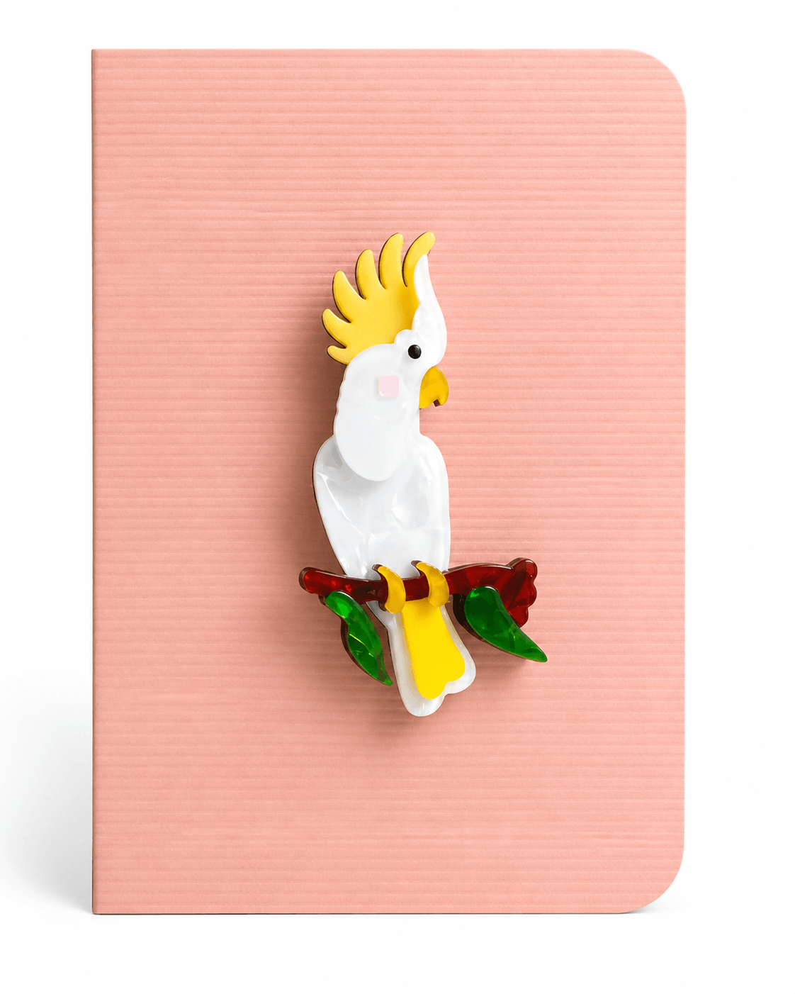Colourful cockatoo keepsake card featuring a detailed tropical bird brooch perched on a branch, mounted on a textured greeting card.