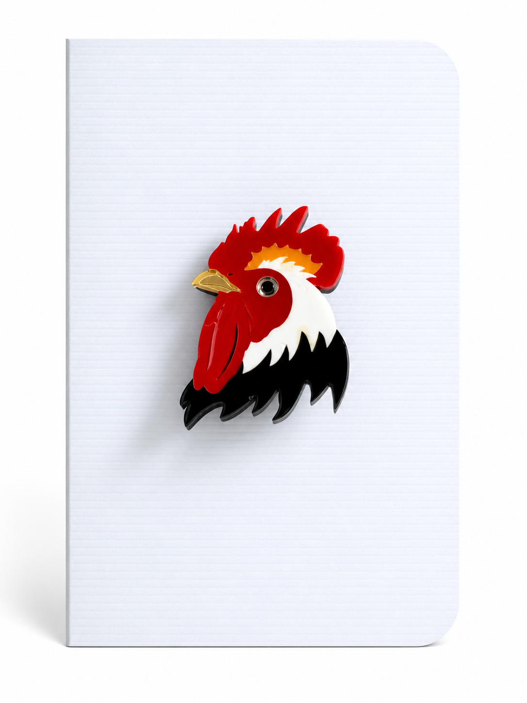 Colourful cockerel keepsake card featuring a detailed rooster brooch mounted on a textured greeting card, inspired by countryside charm.