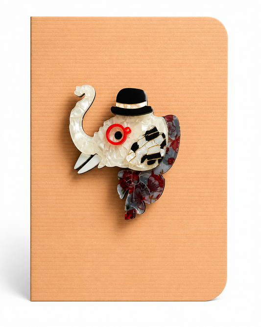 Charming elephant keepsake card featuring a decorative elephant brooch mounted on a textured greeting card, a thoughtful card and keepsake gift in one.