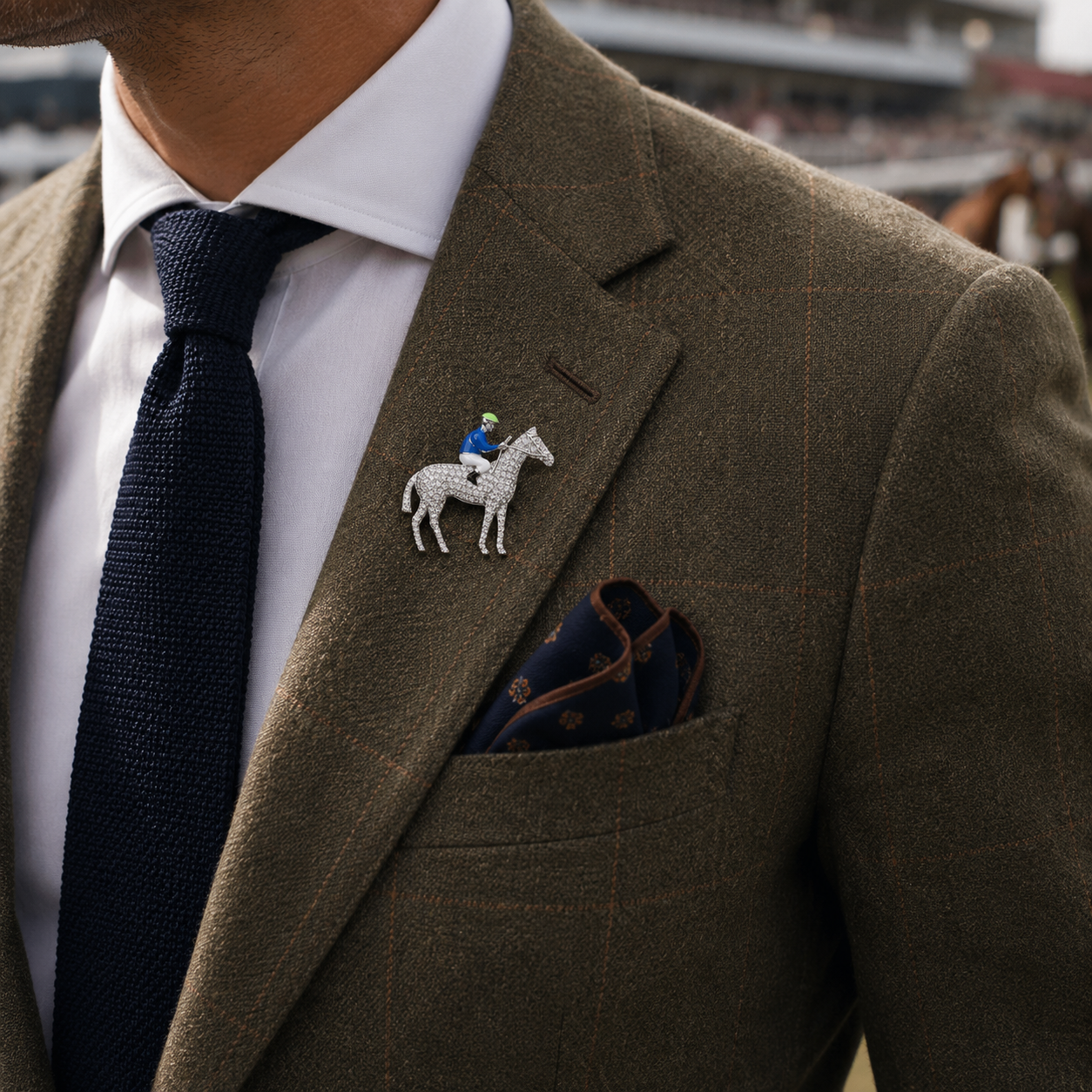 Horse and jockey pavé brooch styled with a tailored race day outfit and navy accessories
