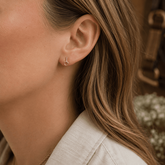 Mini gold vermeil snaffle stud earrings being worn, showing delicate equestrian-inspired styling and everyday elegance