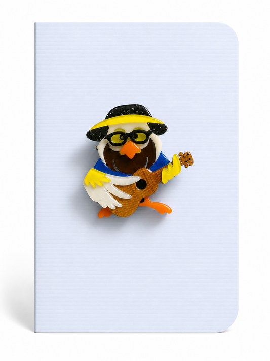 Fun keepsake card featuring a quirky bird playing guitar brooch mounted on a white textured greeting card.