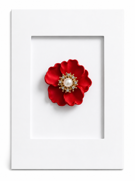 Elegant floral keepsake card featuring a rich red flower brooch with pearl centre mounted within a white presentation card.
