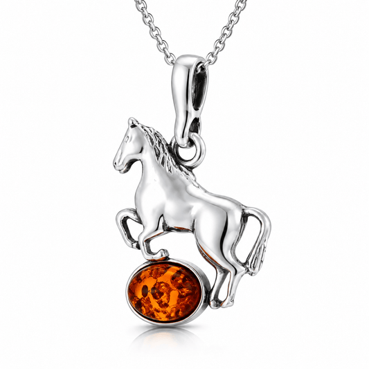 Sterling silver rearing horse pendant necklace with round amber gemstone on a white background