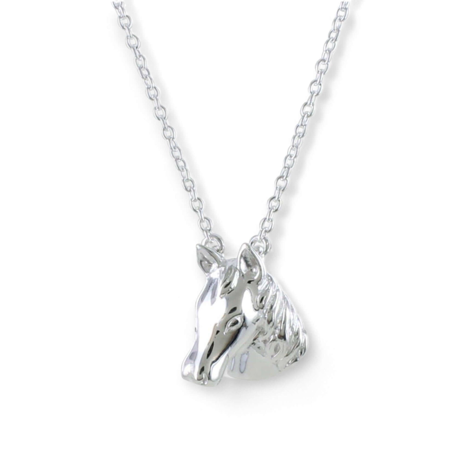 Sterling silver horse head necklace with polished finish on a white background